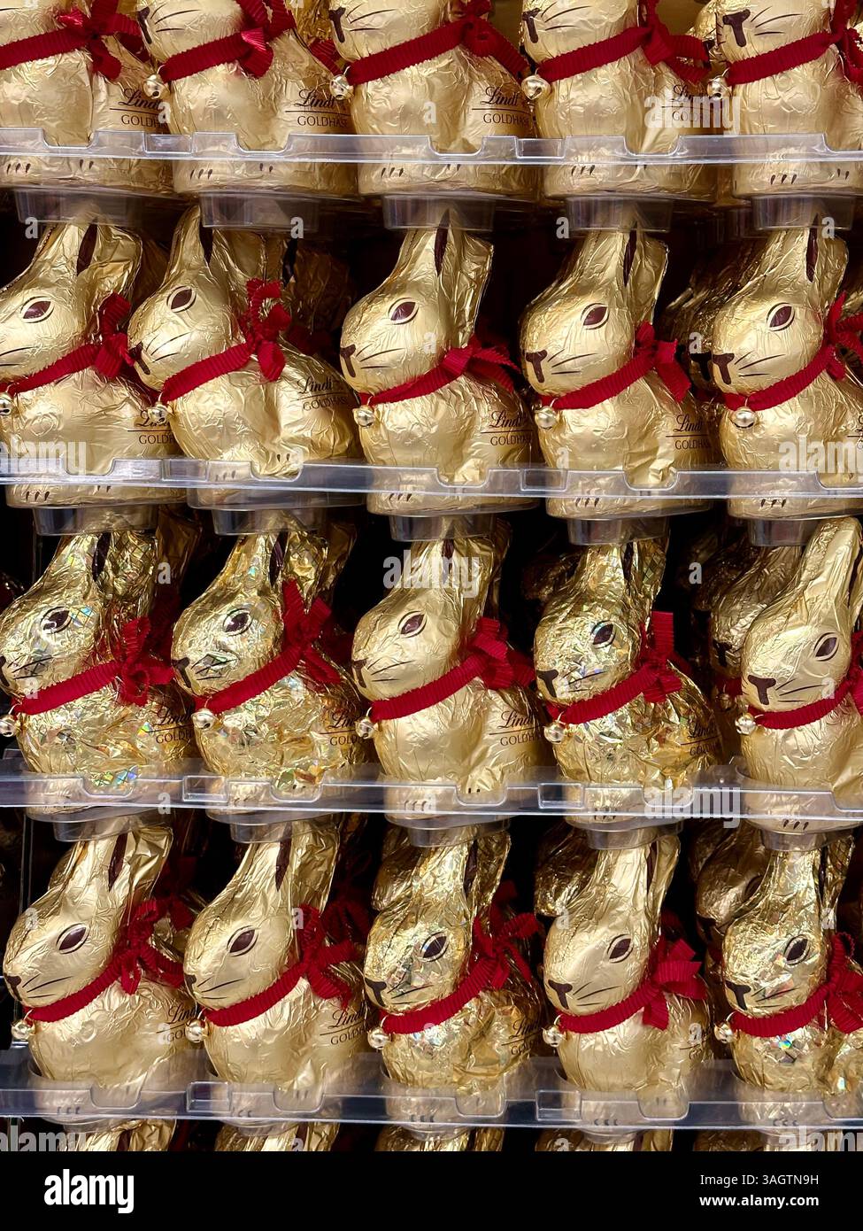 Lindt gold easter bunnies on display in a supermarket - Smartphone Captured Stock Image