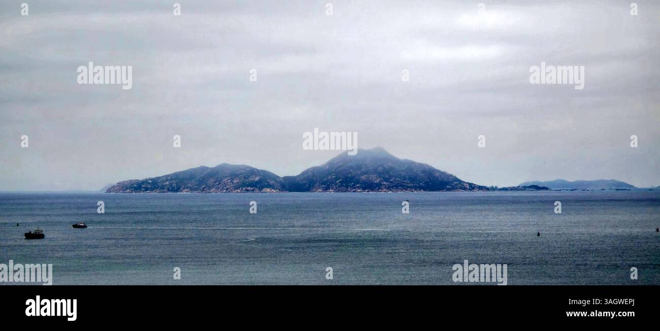 A view of the Chinese island of Xiangzhou / Wailingding island. - Smartphone Captured Stock Image