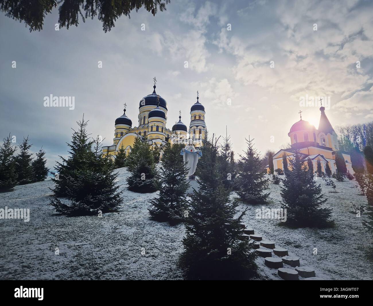 Hancu Monastery outdoors winter view. Traditional Christian Orthodox church located in the middle of the snowy woods in Republic of Moldova. Eastern E - Smartphone Captured Stock Image