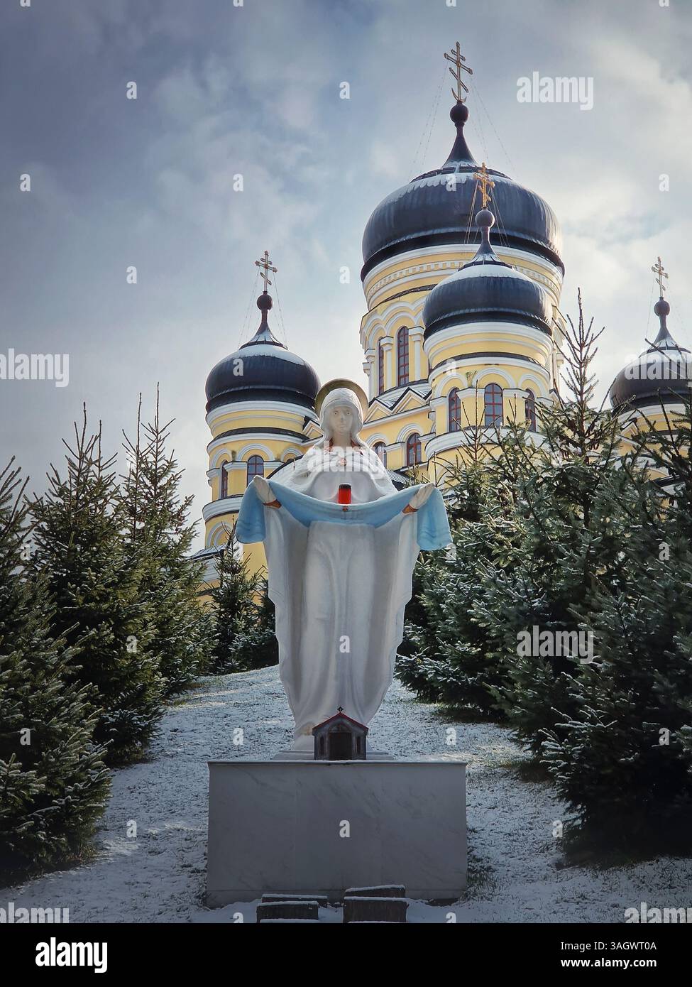 Hancu Monastery outdoors winter view. Traditional Christian Orthodox church located in the middle of the snowy woods in Republic of Moldova. Eastern E - Smartphone Captured Stock Image
