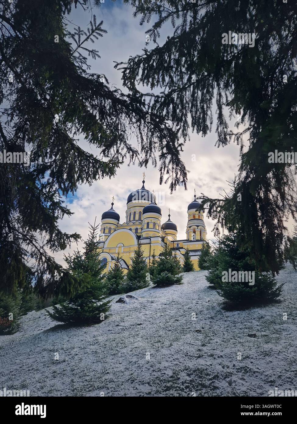 Hancu Monastery outdoors winter view. Traditional Christian Orthodox church located in the middle of the snowy woods in Republic of Moldova. Eastern E - Smartphone Captured Stock Image