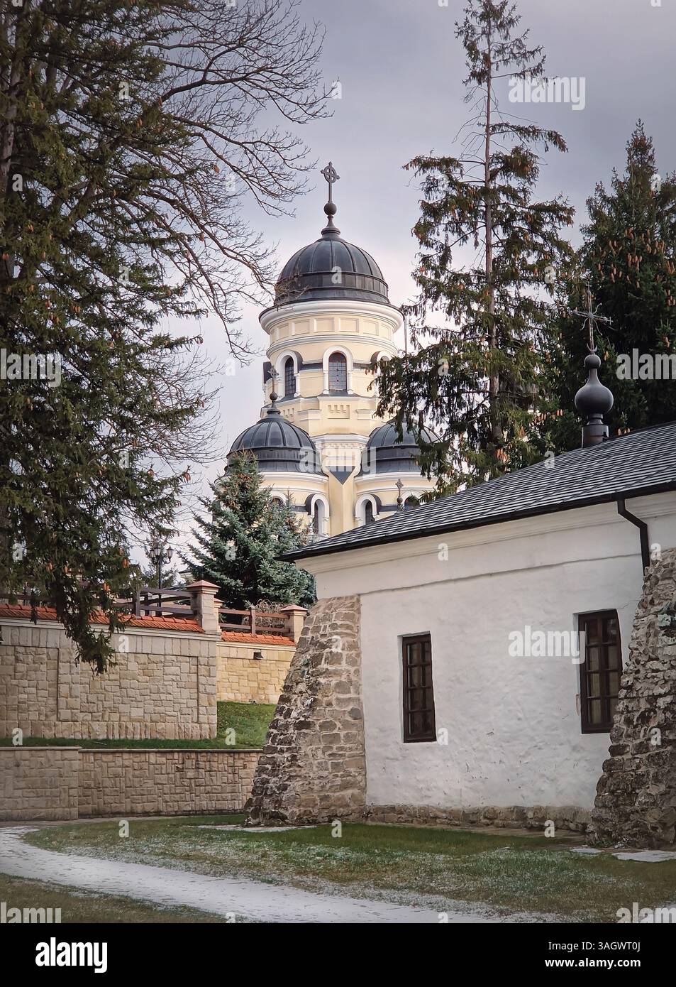 Capriana Monastery outdoors winter view. Traditional Christian Orthodox church located in Republic of Moldova. Eastern Europe basilica traditional arc - Smartphone Captured Stock Image