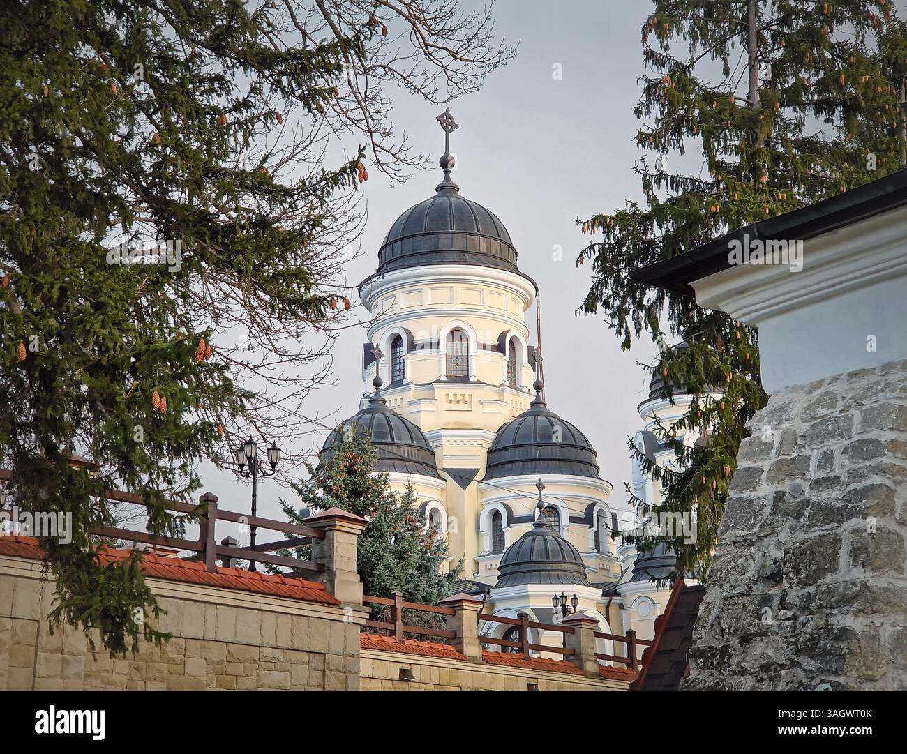 Capriana Monastery outdoors winter view. Traditional Christian Orthodox church located in Republic of Moldova. Eastern Europe basilica traditional arc - Smartphone Captured Stock Image