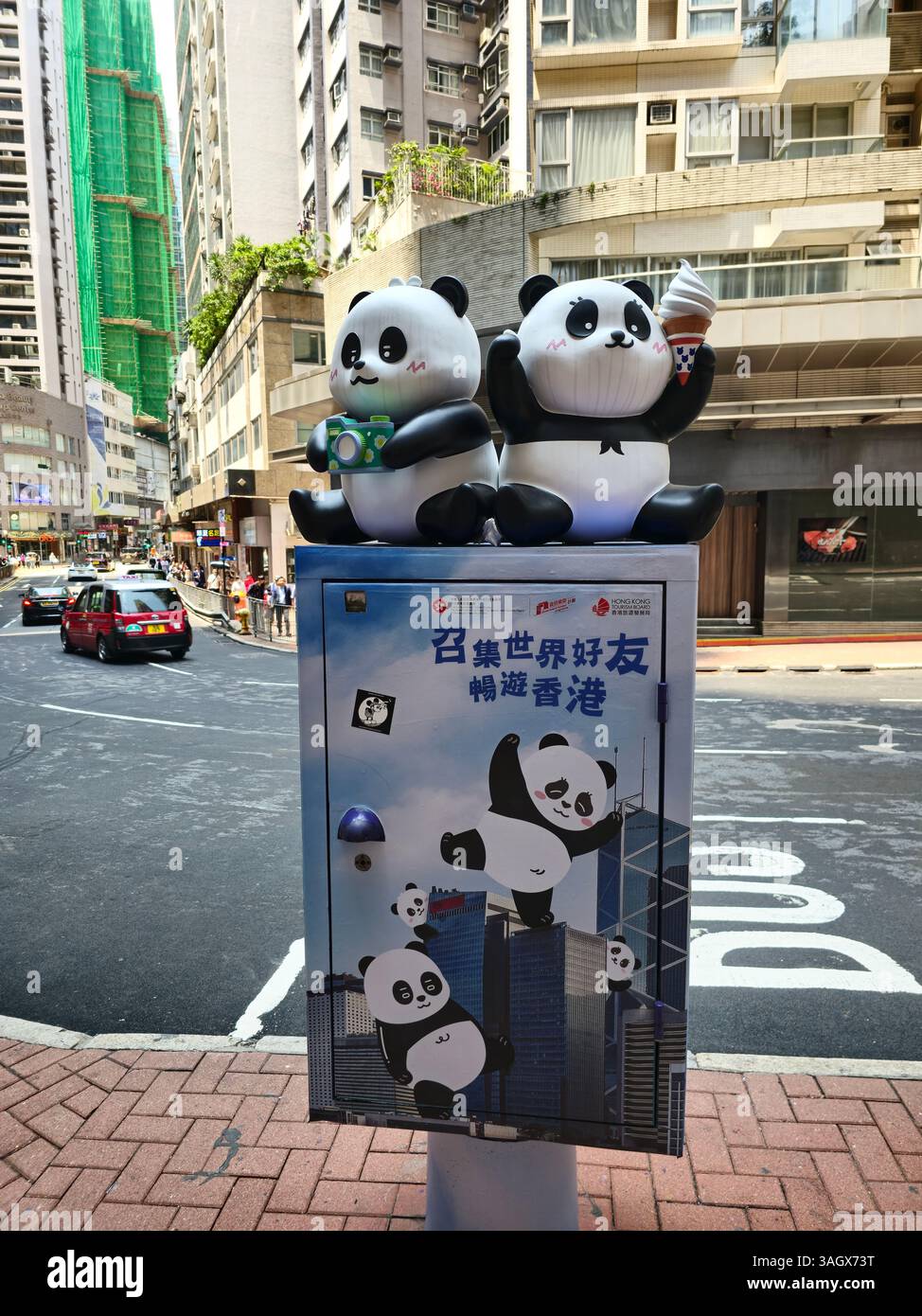 Celebrating the birth of the twin Pandas 'Elder sister' & ' Younger Brother' in the streets of Hong Kong. - Smartphone Captured Stock Image