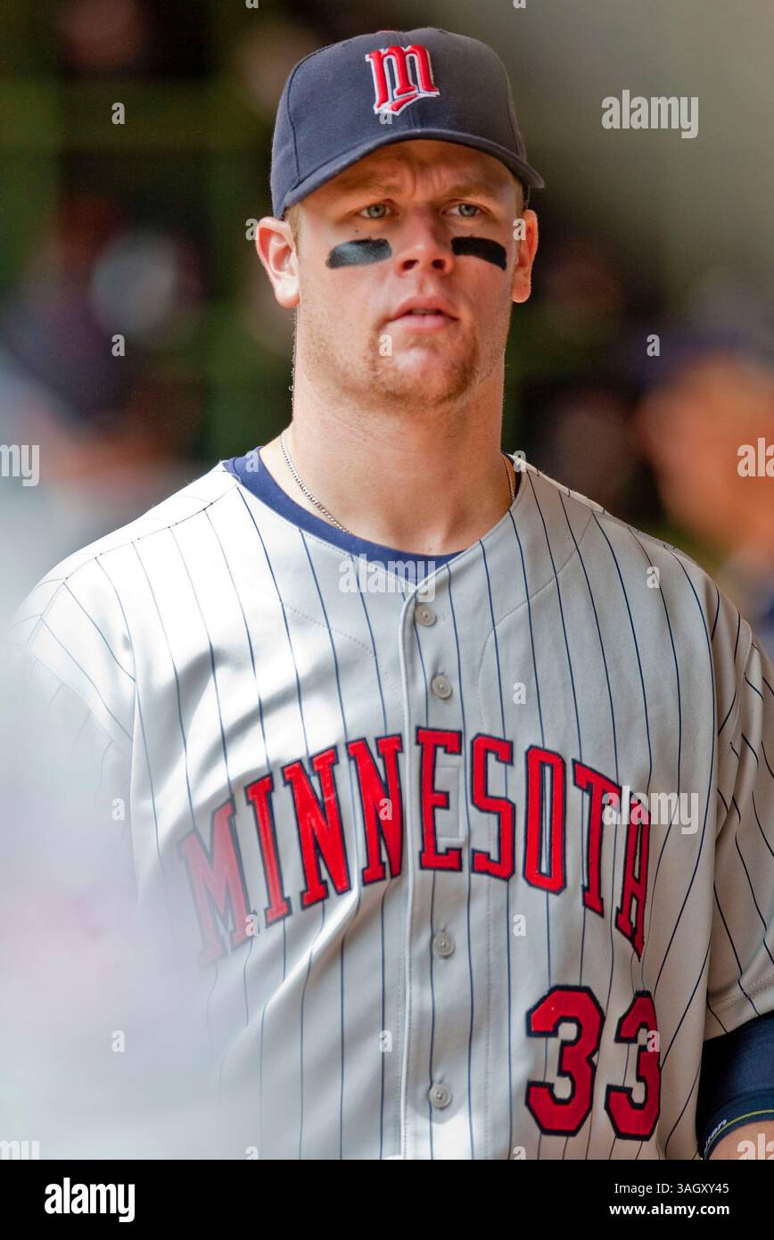 Minnesota Twins Justin Morneau (33) is congratulated by teammate