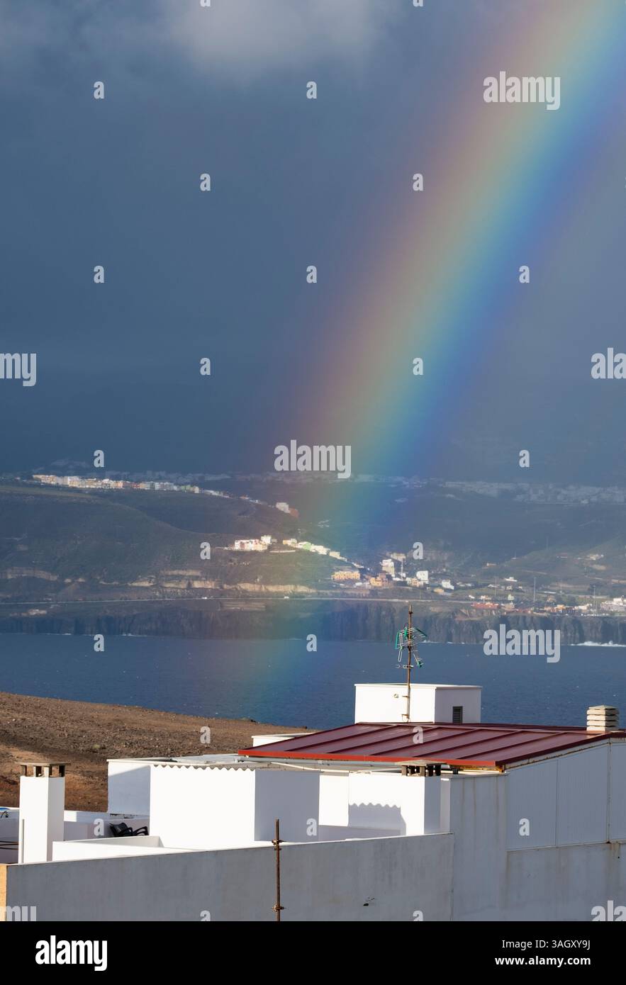 Las Palmas, Gran Canaria, Canary Islands, Spain. 9th April, 2025. A rainbow forms over Las Palmas as storm Olivier sweeps across the Canary Islands bringing heavy rain and strong winds. Localized flooding and road closures due to rockfalls have been reported on Gran Canaria. Credit: Alan Dawson/Alamy Live News Stock Photo