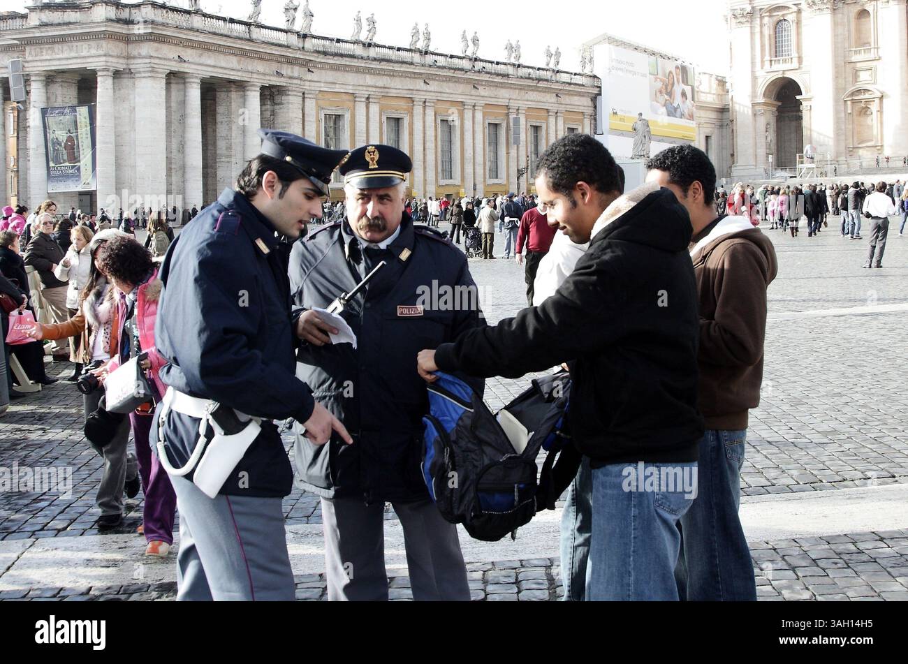 Dec 26, 2009 - Vatican City, Vatican, Italy - Police search a bag in St. Peters Square. A psychologically disturbed woman knocked the Pope down during the midnight mass. The 82-year-old pontiff delivered his Christmas good-wishes during the noon ceremony in front of thousands of people gathered in St. Peter's Square. (Credit Image: © Evandro Inetti/ZUMA Press) Stock Photo