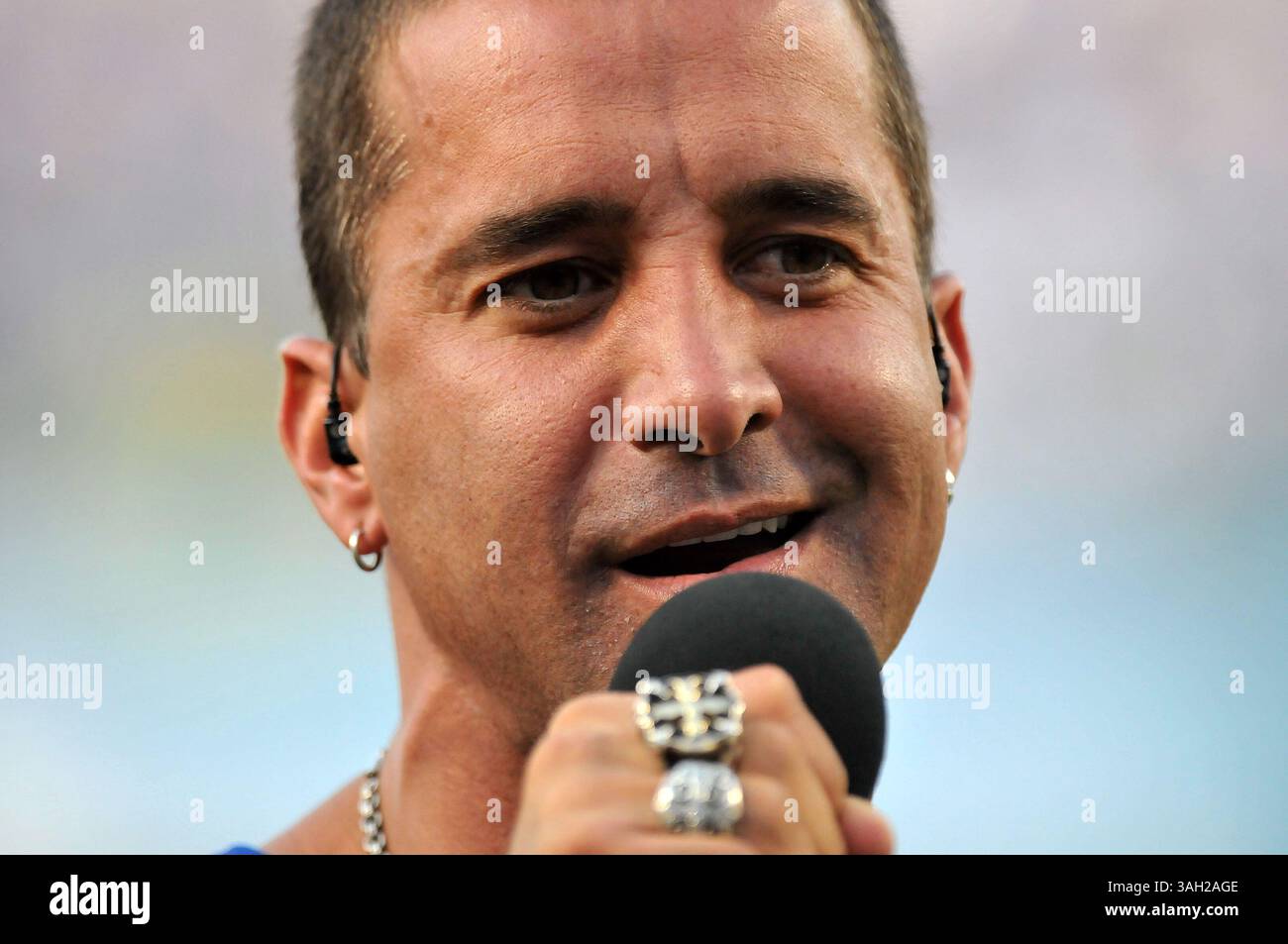 Creed lead singer Scott Stapp, left, listens as director