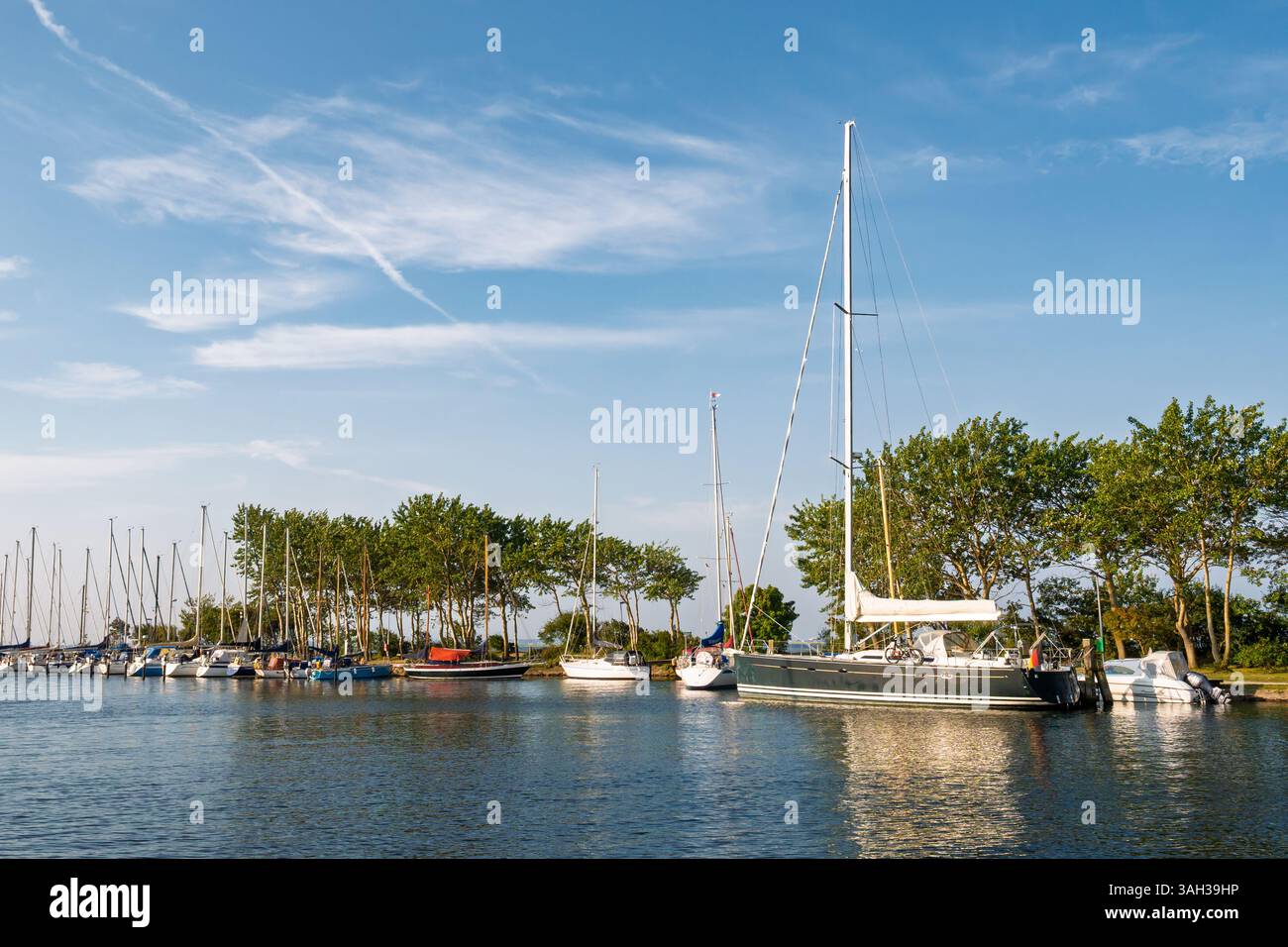 Sailing boats moored in marina of Orth harbour, Fehmarn Island, Schleswig-Holstein, Germany Stock Photo