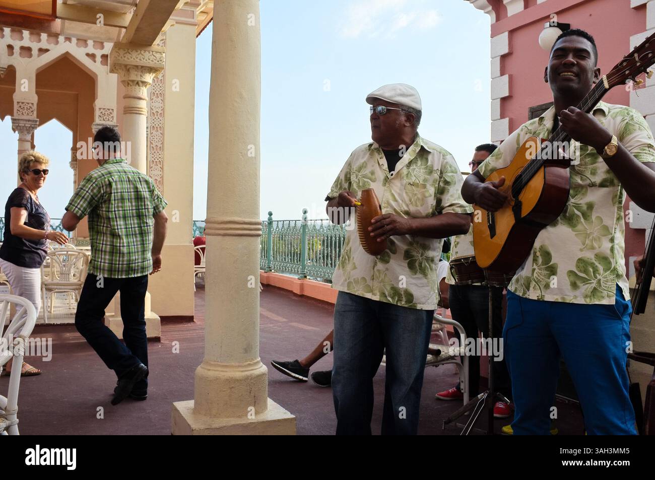 March 12, 2015 - Cienfuegos, Cuba - A couple dances to the sound of a live band on the roof of Palacio de Valle in Cienfuegos, on the southern coast of Cuba. Palacio de Valle is an architectural jewel located in the Punta Gorda, reminiscent of Spanish-Moorish art with influences of Gothic, Romanesque and Baroque arts. (Credit Image: © Nir Alon/ZUMA Wire) Stock Photo