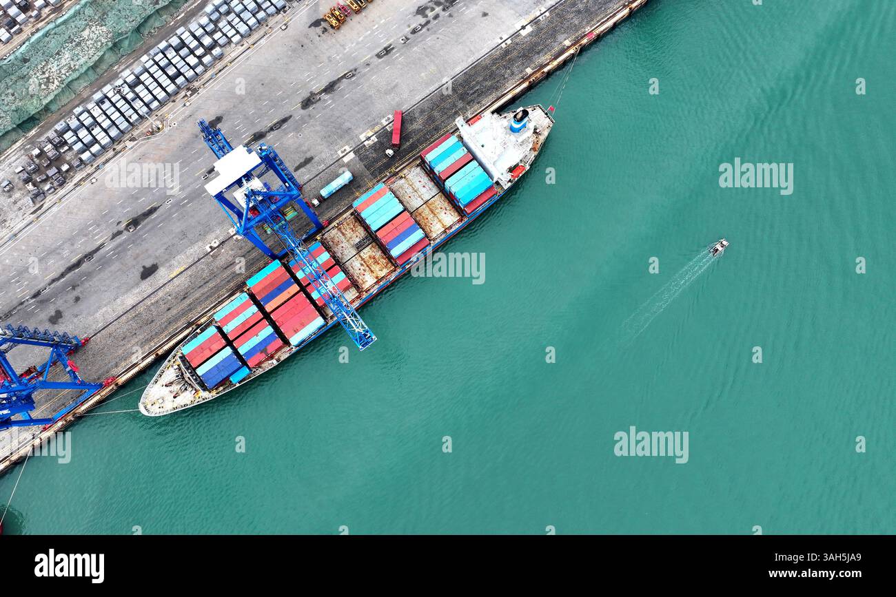 SHISHI, CHINA - APRIL 5, 2025 - Cargo ships load and unload containers ...