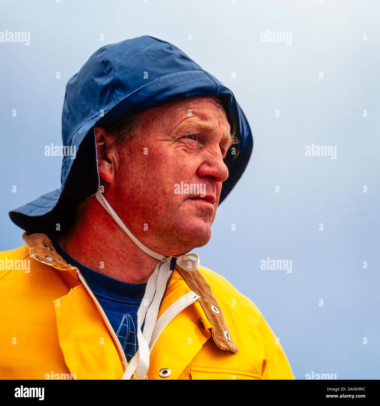Man in rain clothes Stock Photo