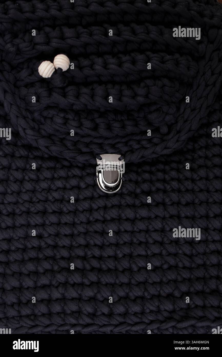 Black crochet backpack or bag full frame crop   background Stock Photo
