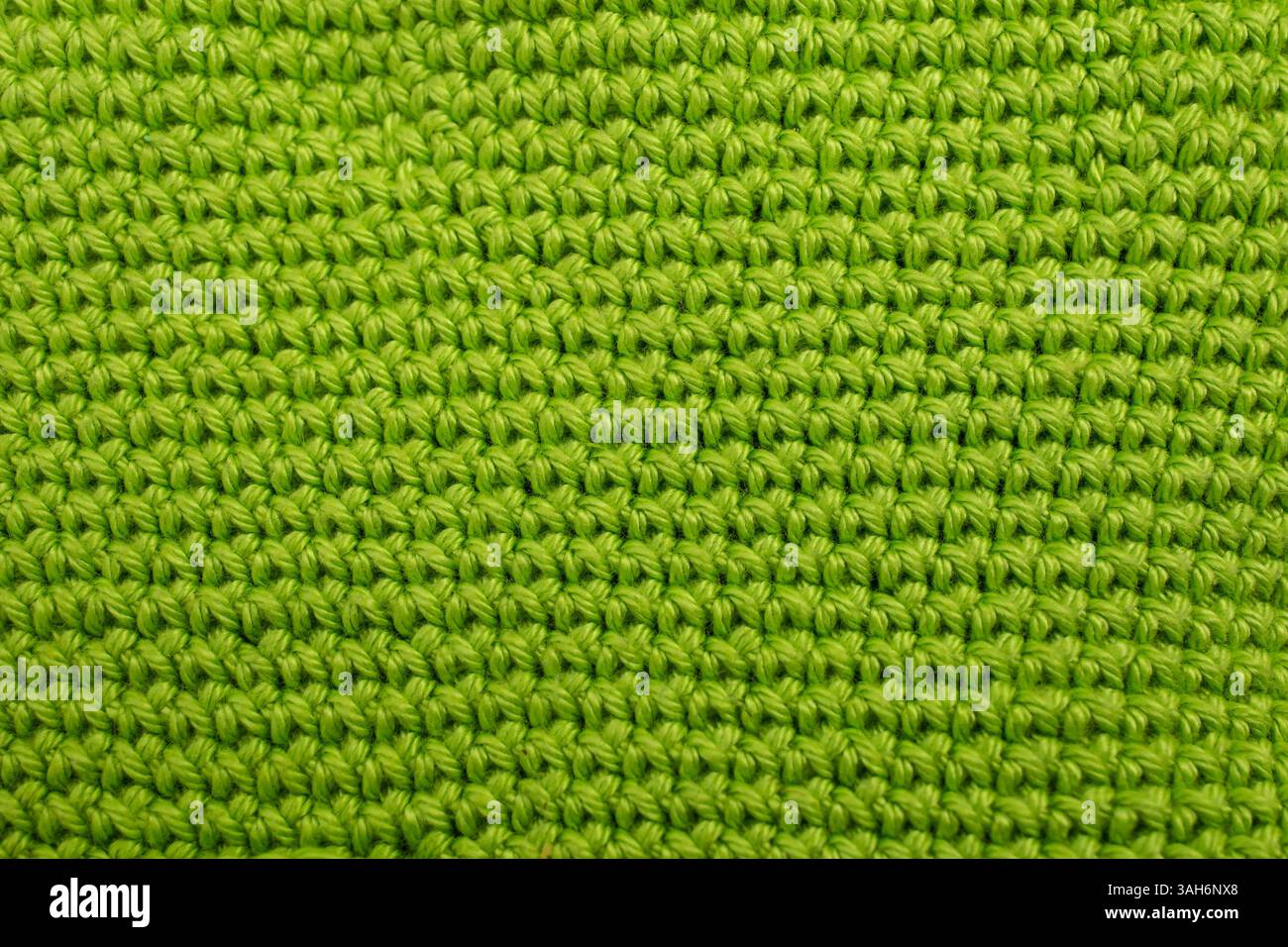 Hand made crochet pattern, textured mint green abstract background, with horizontal lines Stock Photo