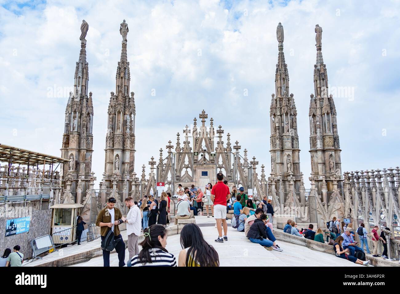 Milan, Italy - 05.14.2024: Tourists enjoy a sunny day on the rooftop ...