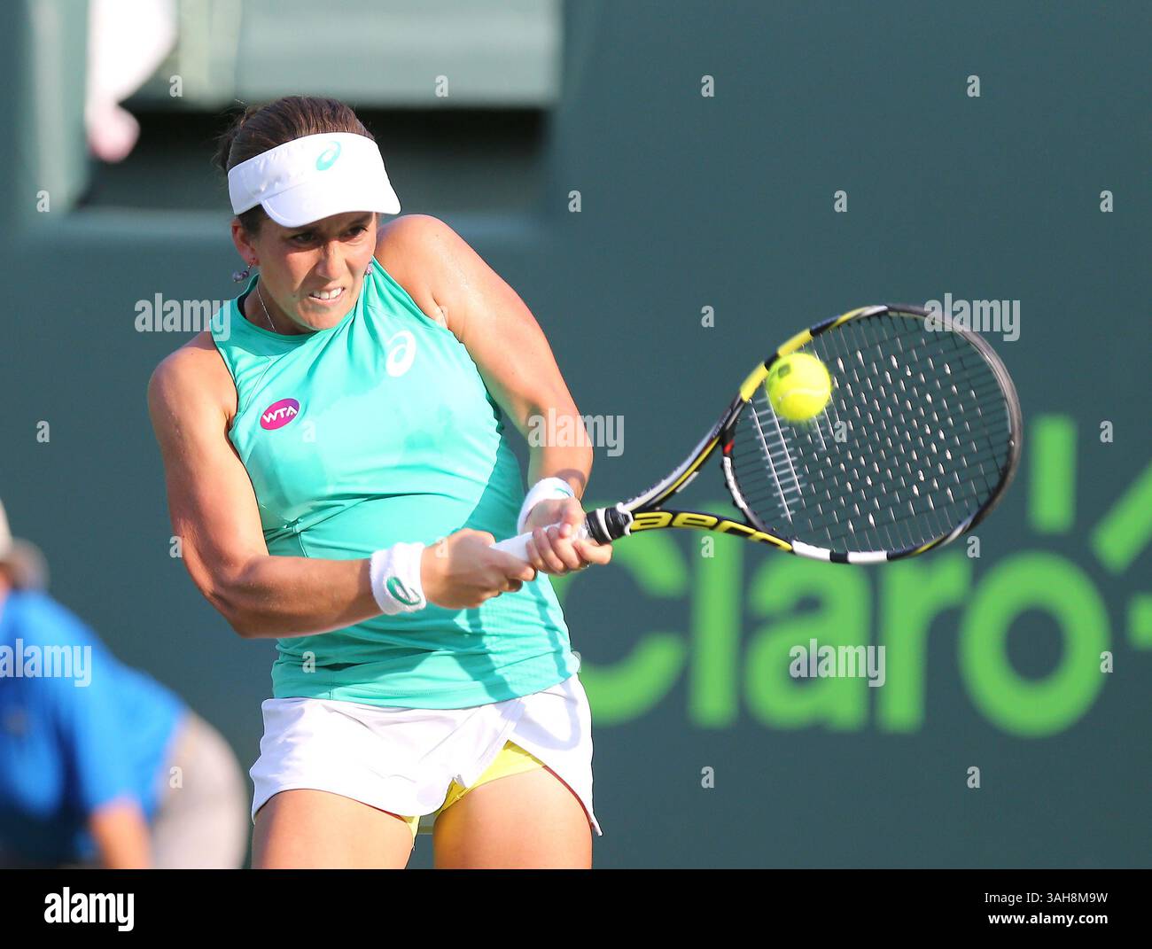 March 25, 2015 - Key Biscayne, FL, USA - Irina Falconi, from USA, returns the ball to Monica Puig, from Puerto Rico, during their first-round match on Day 3 of the Miami Open tennis tournament on Wednesday, March 25, 2015, at Crandon Park in Key Biscayne, Fla. (Credit Image: © David Santiago/TNS/ZUMA Wire) Stock Photo