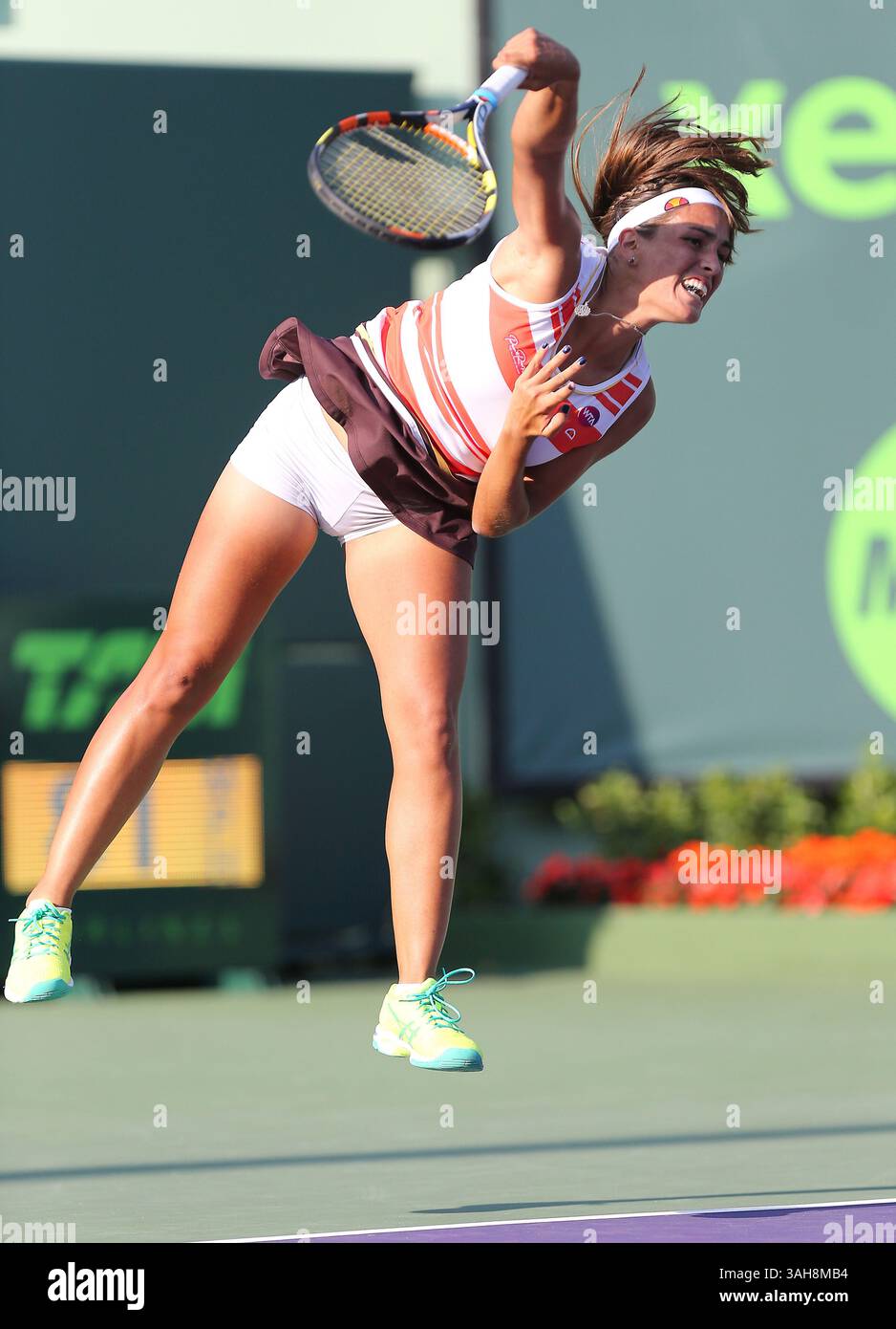 March 25, 2015 - Key Biscayne, FL, USA - Monica Puig, from Puerto Rico, serves the ball to Irina Falconi, from the USA, during their first-round match on Day 3 of the Miami Open tennis tournament on Wednesday, March 25, 2015, at Crandon Park in Key Biscayne, Fla. (Credit Image: © David Santiago/TNS/ZUMA Wire) Stock Photo