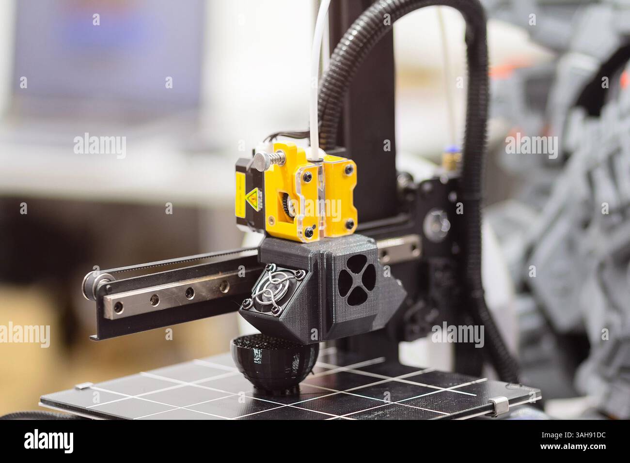 Modern 3D printer printing plastic product. Industry Stock Photo
