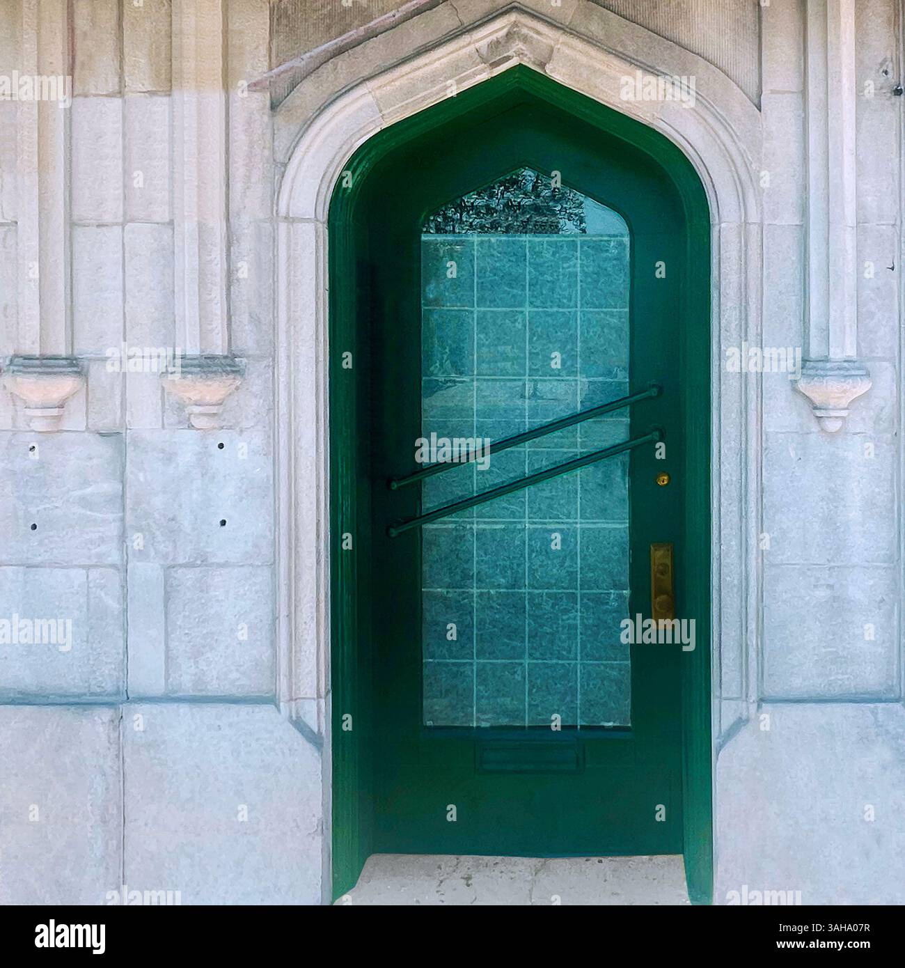 Green door door with tinted glass, set in a light stone Gothic Revival facade in Chicago. - Smartphone Captured Stock Image