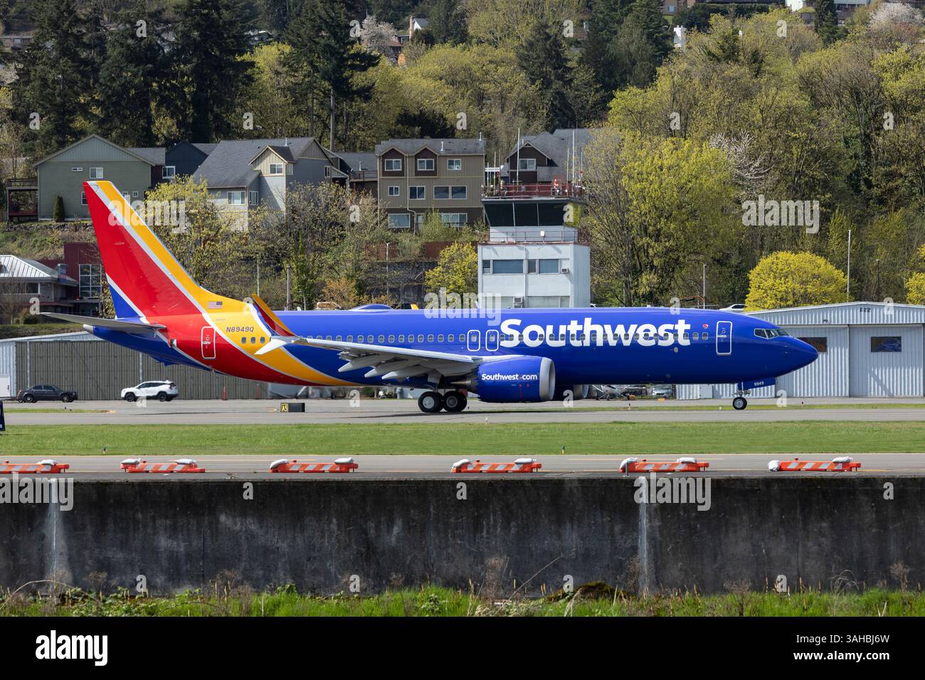 Renton, Washington, USA. 9th April 2025. A Southwest Airlines 737 MAX 8, currently in production at the Boeing Renton Factory, taxis by the air traffic control tower on a test flight at Renton Municipal Airport. Credit: Paul Christian Gordon/Alamy Live News Stock Photo