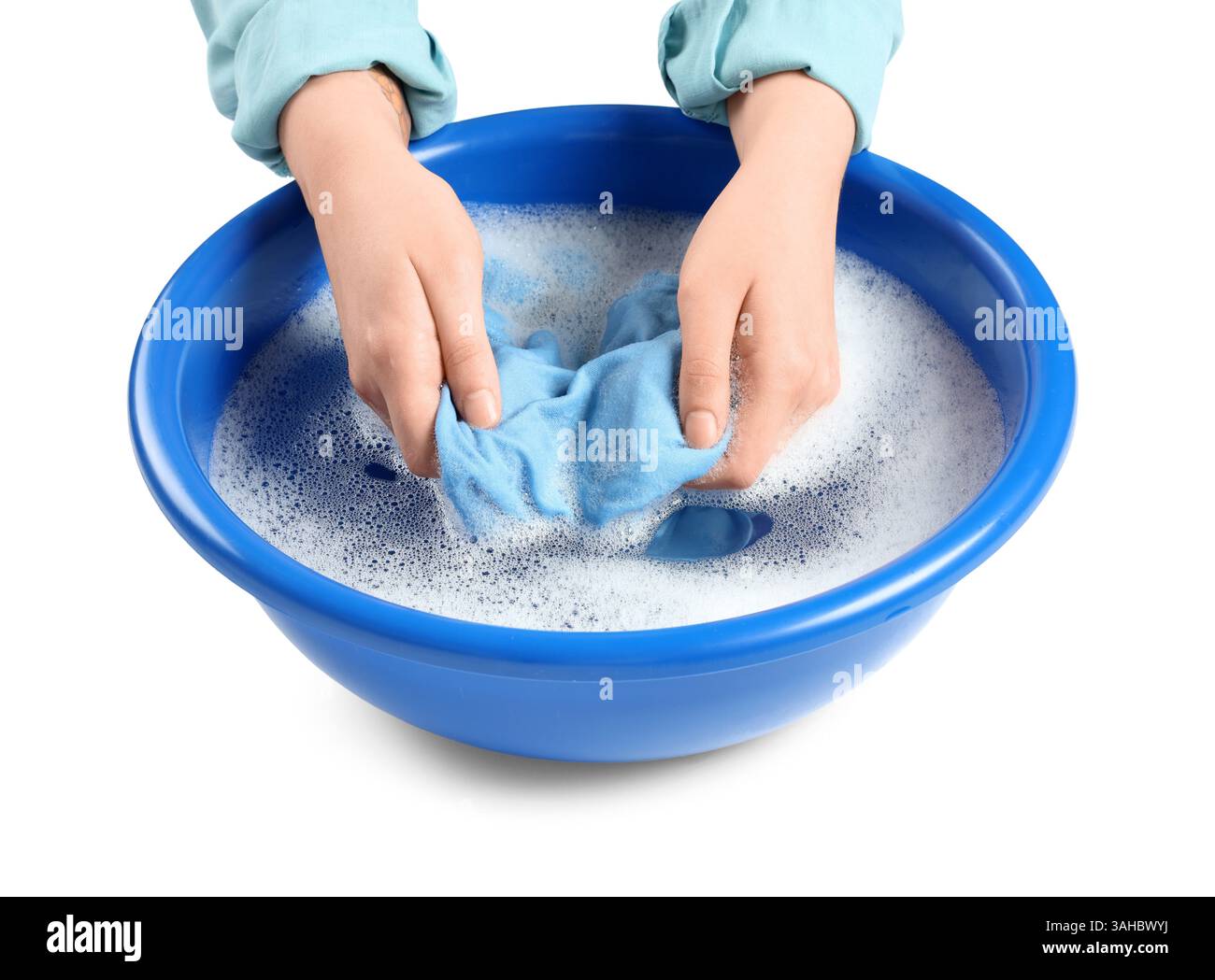Woman washing laundry in basin with foam and water on white background ...