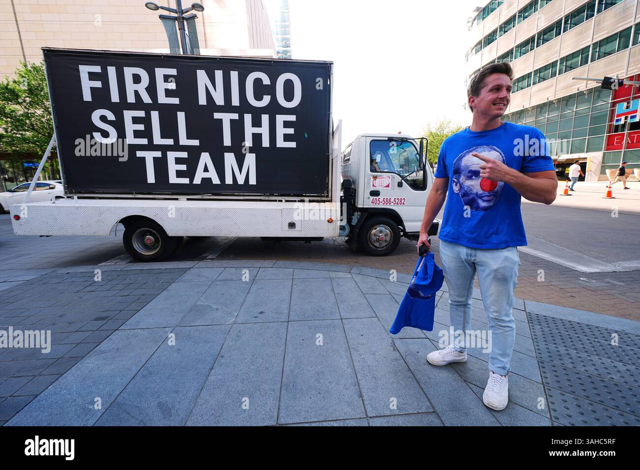 Jacob Reedy stands on a sidewalk near American Airlines Center as a ...
