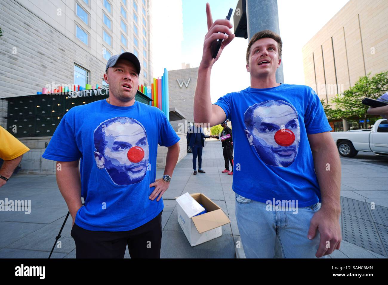 John Bianchino, left, and Jacob Reedy, right, wear shirts that show the ...