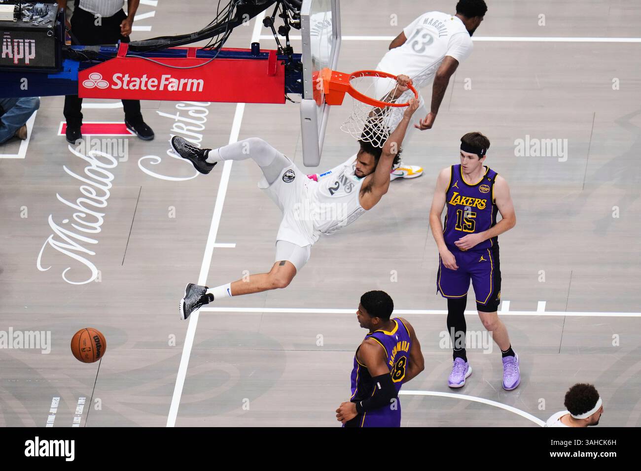Bottom Rui Dallas Mavericks' Dereck Lively II (2) dunks between Los Angeles Lakers ...