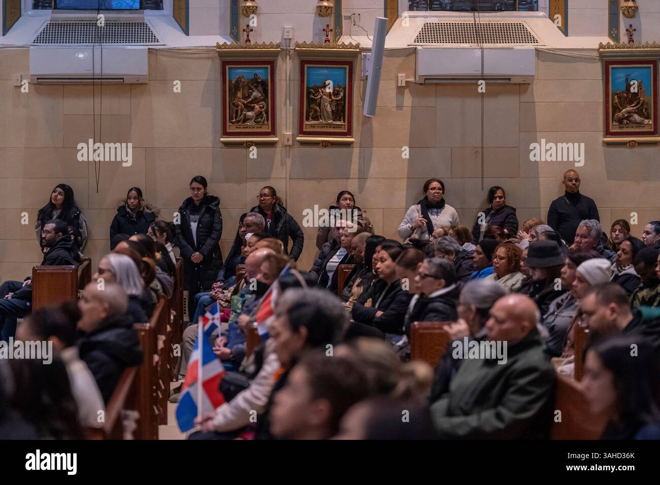 People attend a Mass for the victims of the Jet Set club roof collapse ...