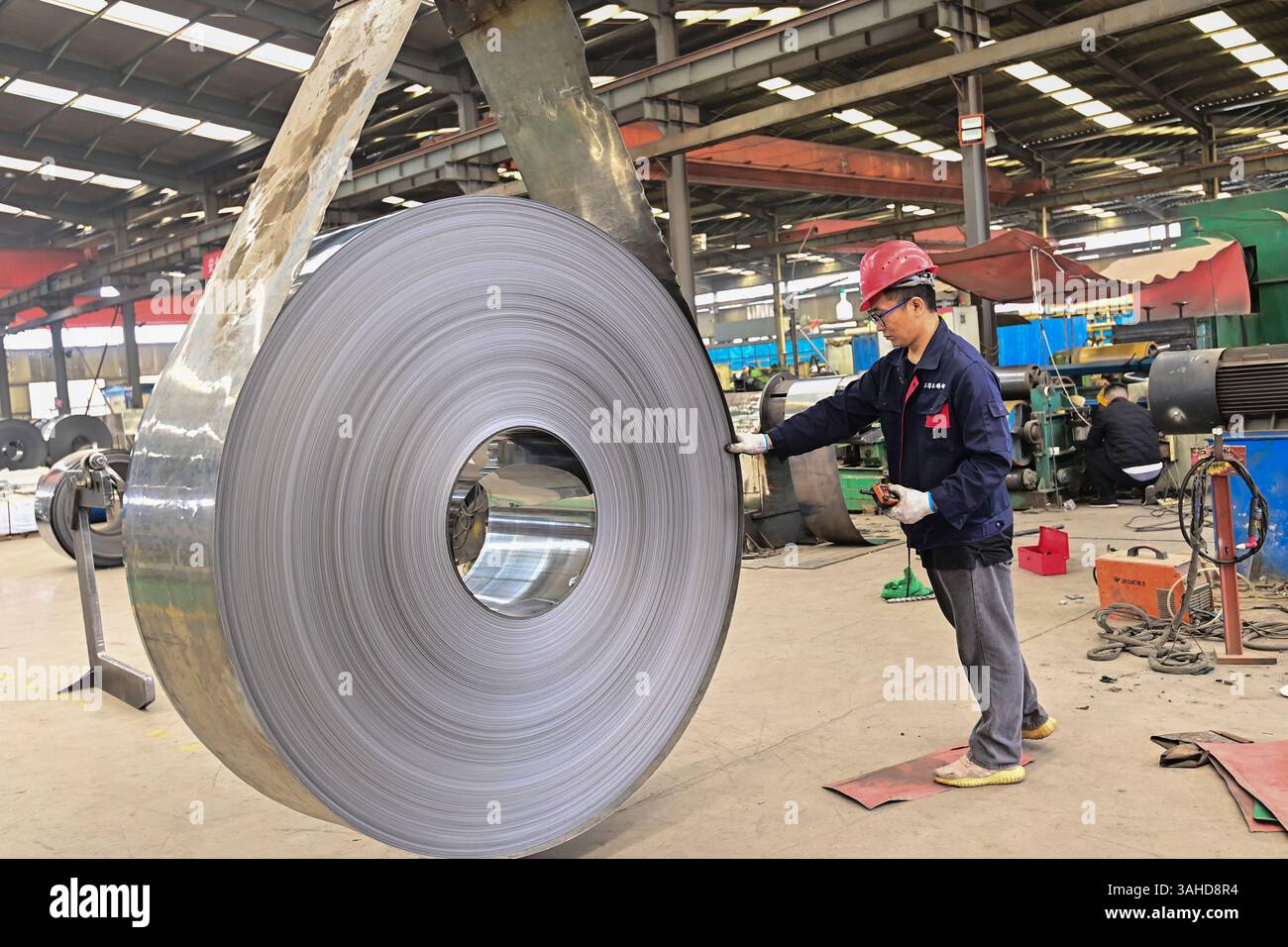 QINGZHOU, CHINA - APRIL 10, 2025 - A worker works in the workshop of a ...