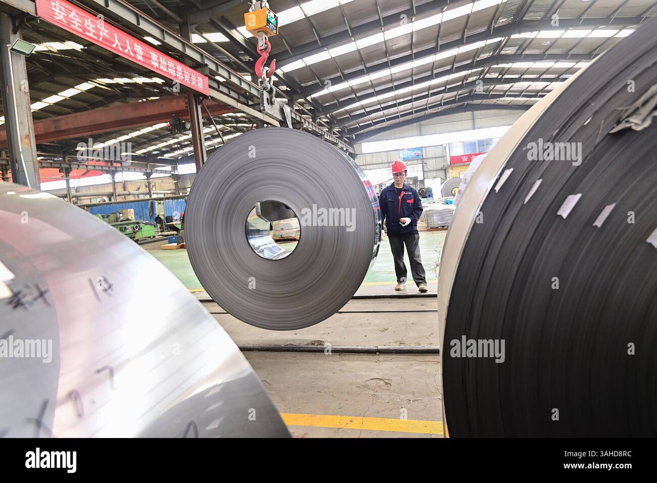 QINGZHOU, CHINA - APRIL 10, 2025 - A worker works in the workshop of a ...