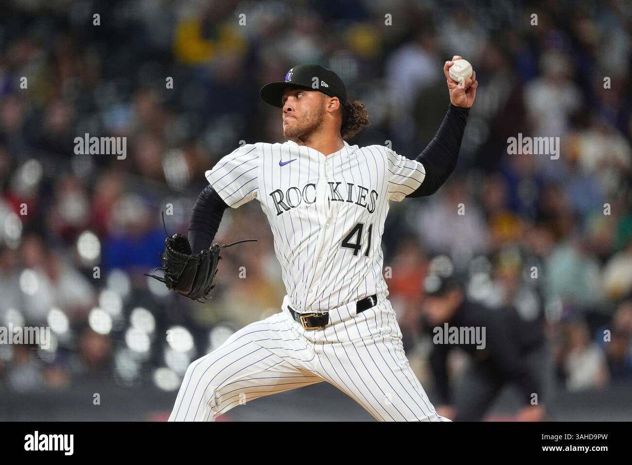 Colorado Rockies relief pitcher Luis Peralta works against the ...