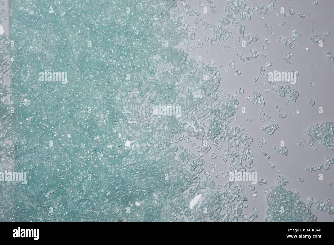 broken window glass on a tiles floor  Stock Photo