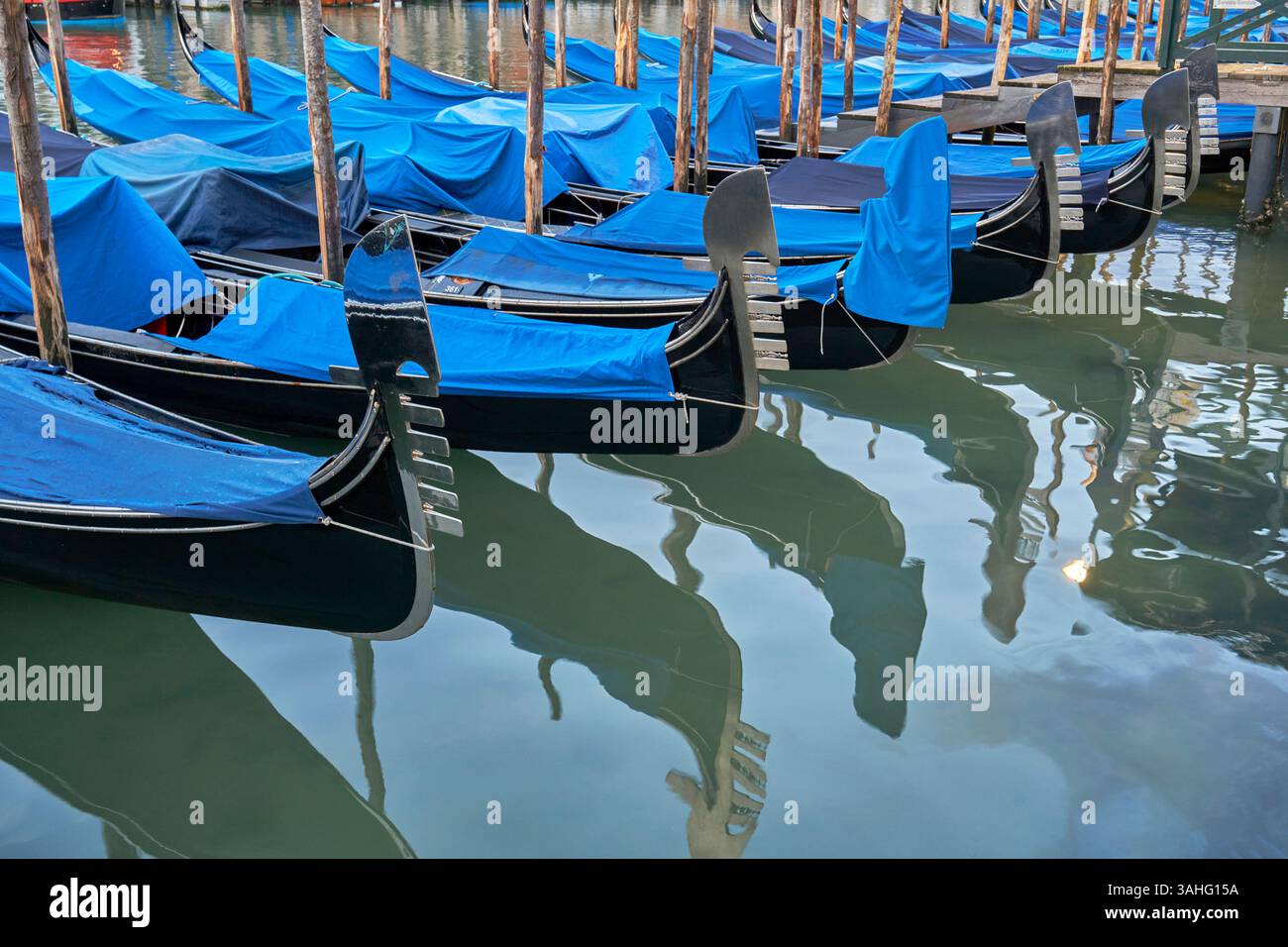 Gondolas on the quay and the reflections. Venice Stock Photo - Alamy