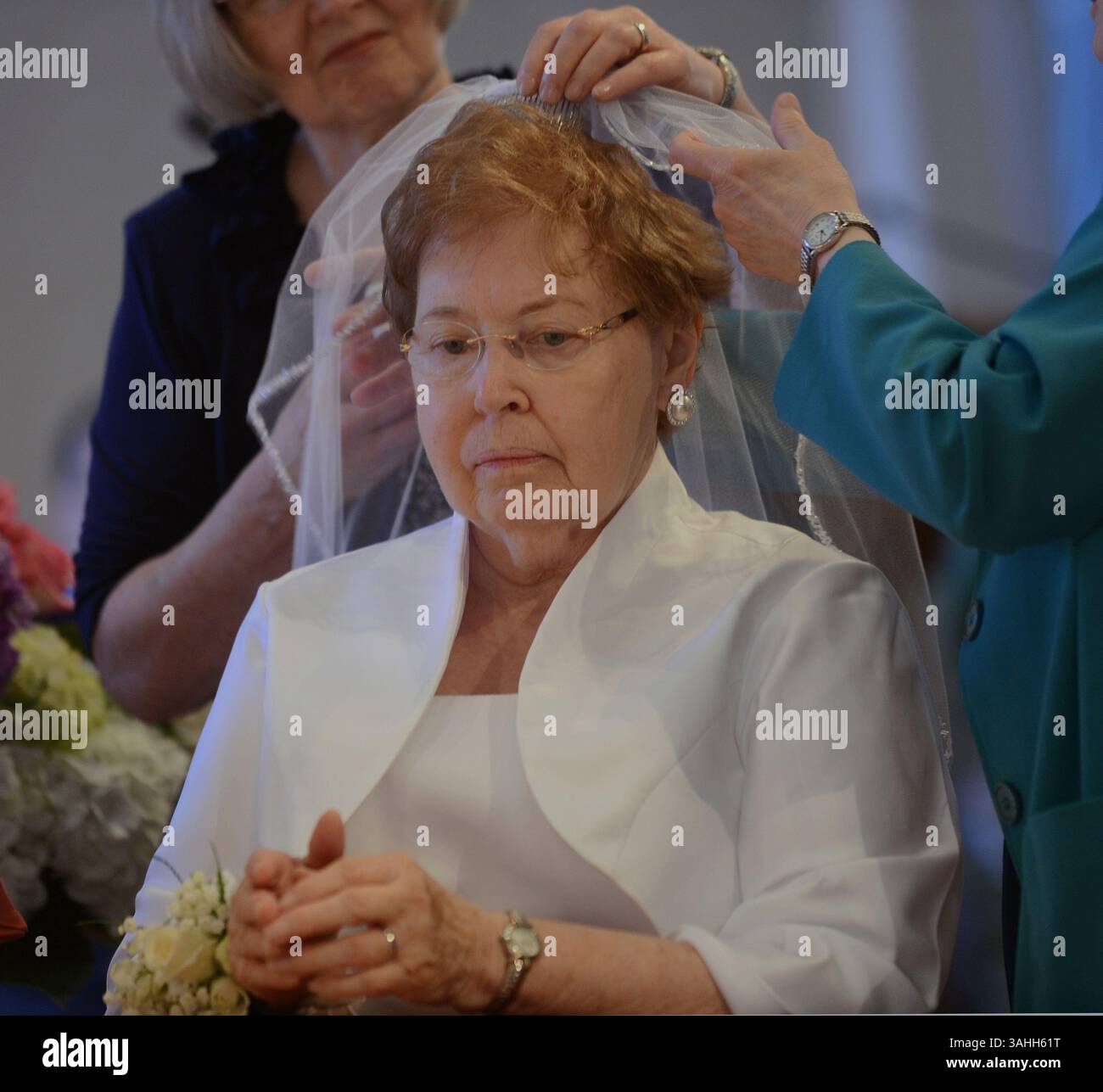 May 31, 2015 - Gipsonia, PA, USA - Sheila Ryan of Valenica receives a veil on May 31, 2015, during the celebration of the first Rite of Consecration of Virgins Living in the World in the Diocese of Pittsburgh since the Catholic Church restored that liturgical rite in 1970. (Credit Image: © Nate Guidry/TNS/ZUMA Wire) Stock Photo