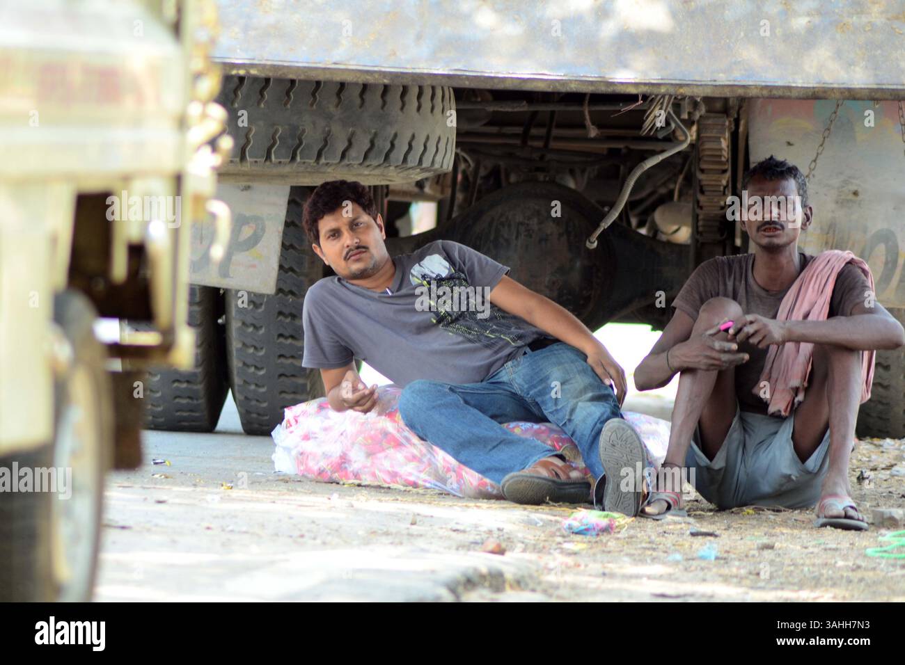 June 2, 2015 - Allahabad, Uttar Prades, India - INDIA, Allahabad: Indian truc driver rest under shade of their truck during a hot day in Allahabad on 06-02-2015. The heat wave gripping India has killed 2,330 people, officials announced on Tuesday, as meteorologists warned that monsoon rains could still be days away. The worst-hit state was Andhra Pradesh on the country's southeast coast, where 42 people have died in the past 24 hours. photo by prabhat kumar verma (Credit Image: © Prabhat Kumar Verma/ZUMA Wire/ZUMAPRESS.com) Stock Photo