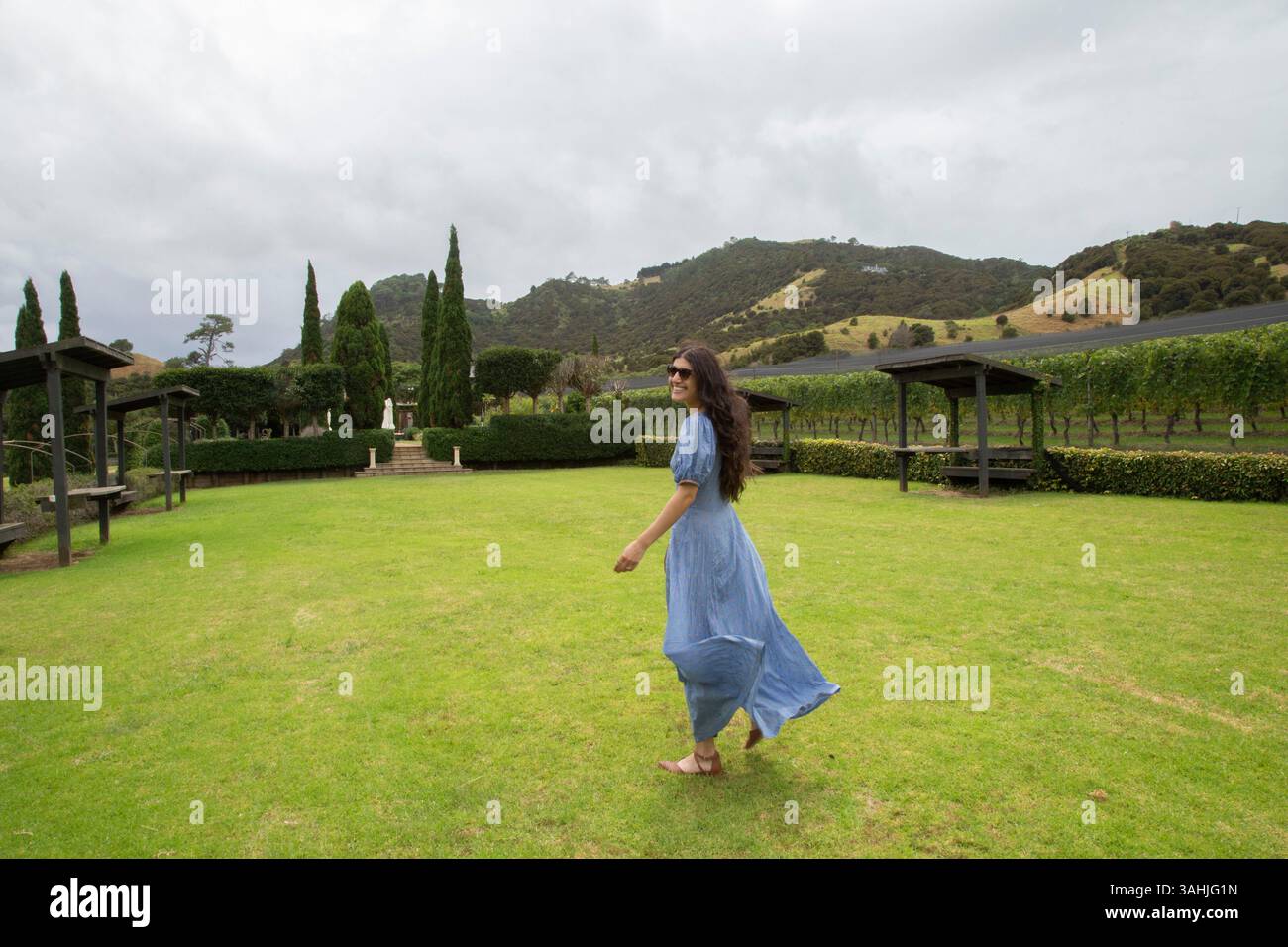 Woman in flowing dress walks hi-res stock photography and images - Alamy