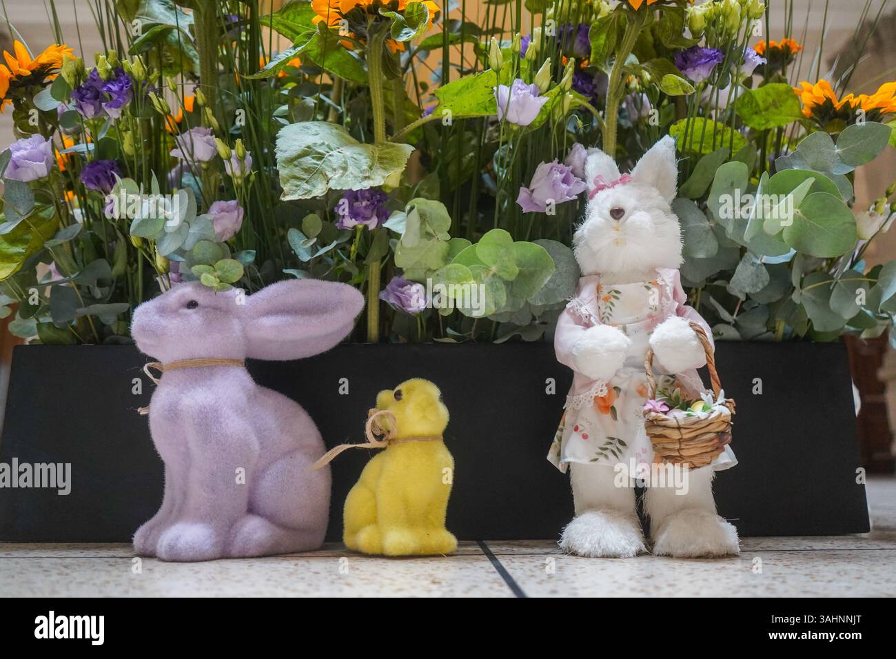 London UK 10 April 2025. A display of Easter bunnies dressed with ...