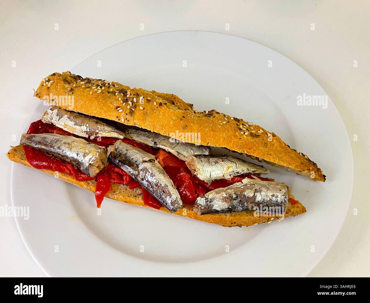 Sardines and red peppers on integral bread. Spain. - Smartphone Captured Stock Image