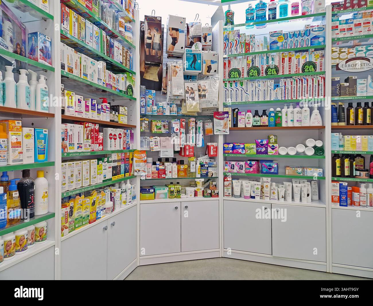 UNGHENI, MOLDOVA - DECEMBER 17, 2023 View of pharmacy stocked shelves with healthcare products, cosmetics and medicaments - Smartphone Captured Stock Image