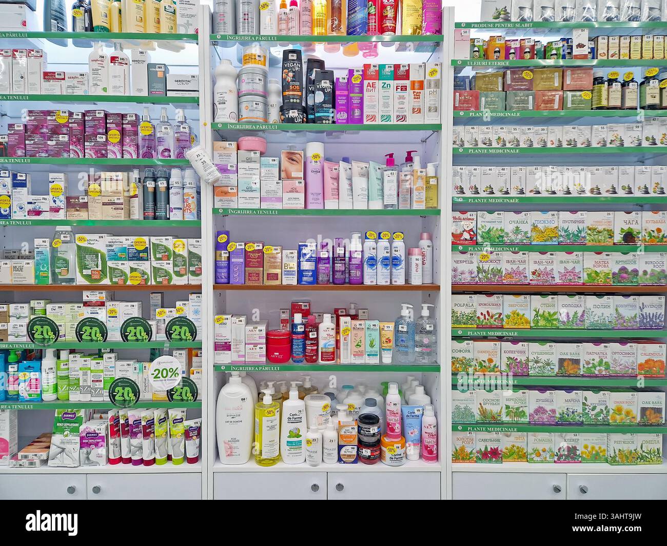 UNGHENI, MOLDOVA - DECEMBER 17, 2023 View of pharmacy stocked shelves with healthcare products, cosmetics and medicaments - Smartphone Captured Stock Image