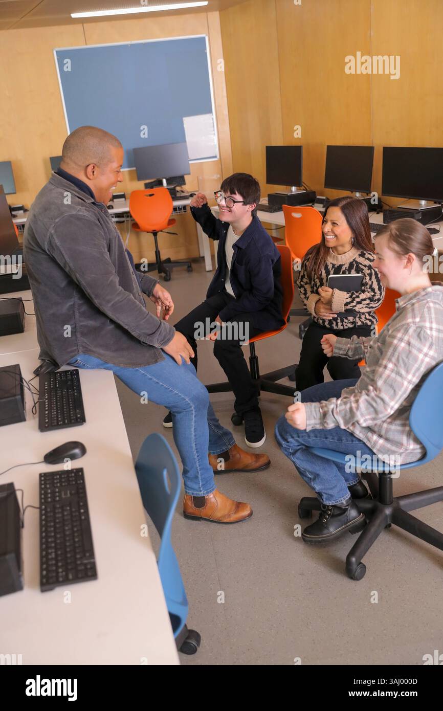 Teacher and students with disabilities at university Stock Photo