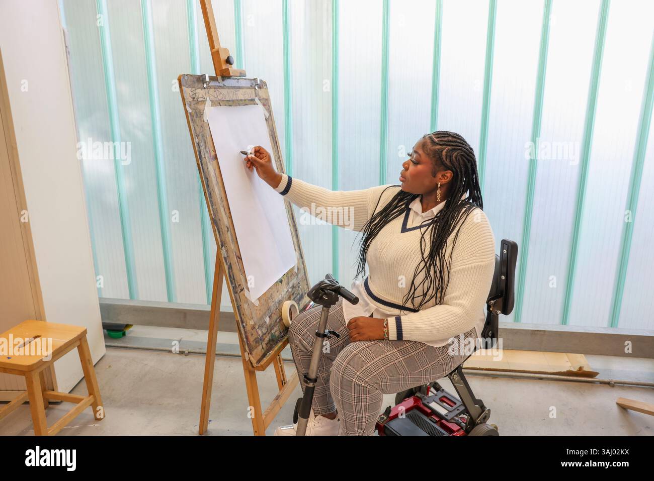 Disabled woman drawing at art classes Stock Photo