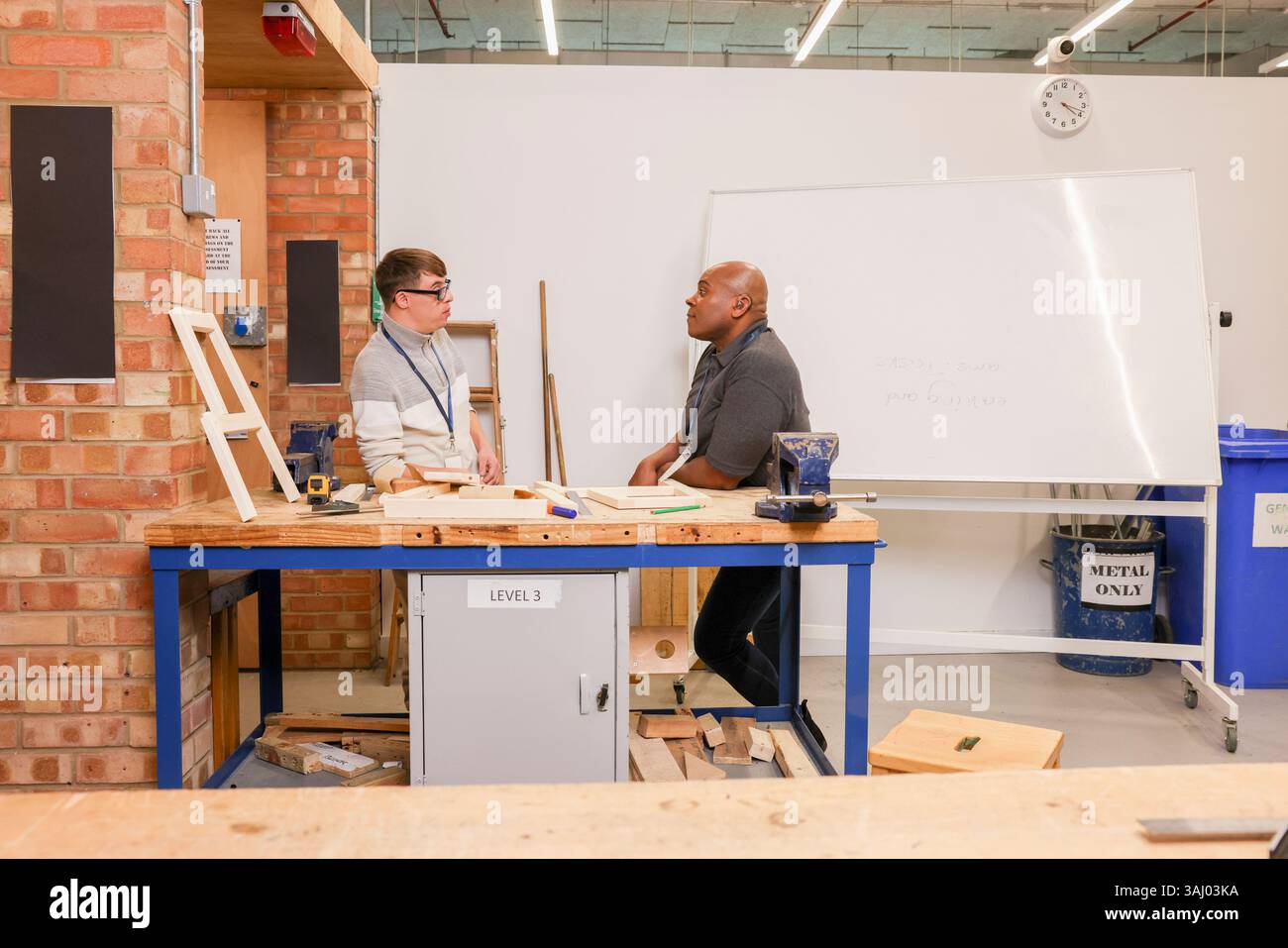 Disabled men working in workshop Stock Photo
