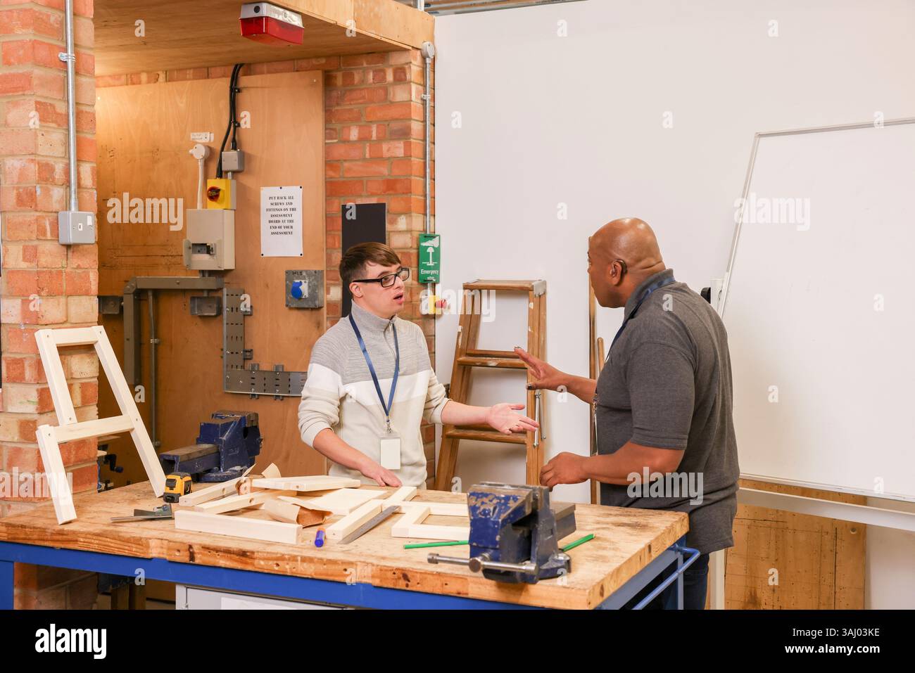 Disabled men working in workshop Stock Photo