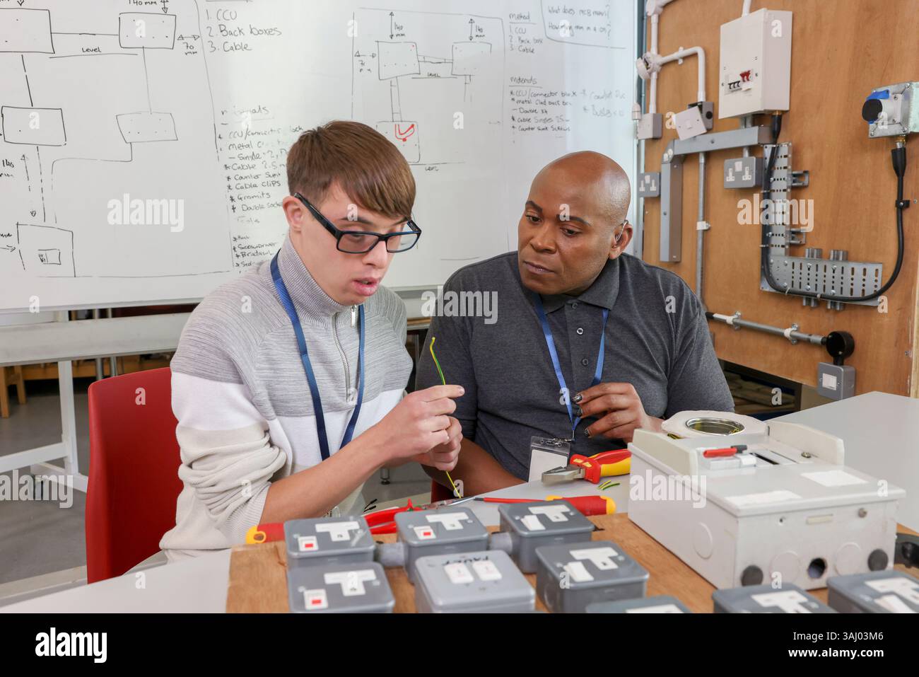 Disabled men working in workshop Stock Photo