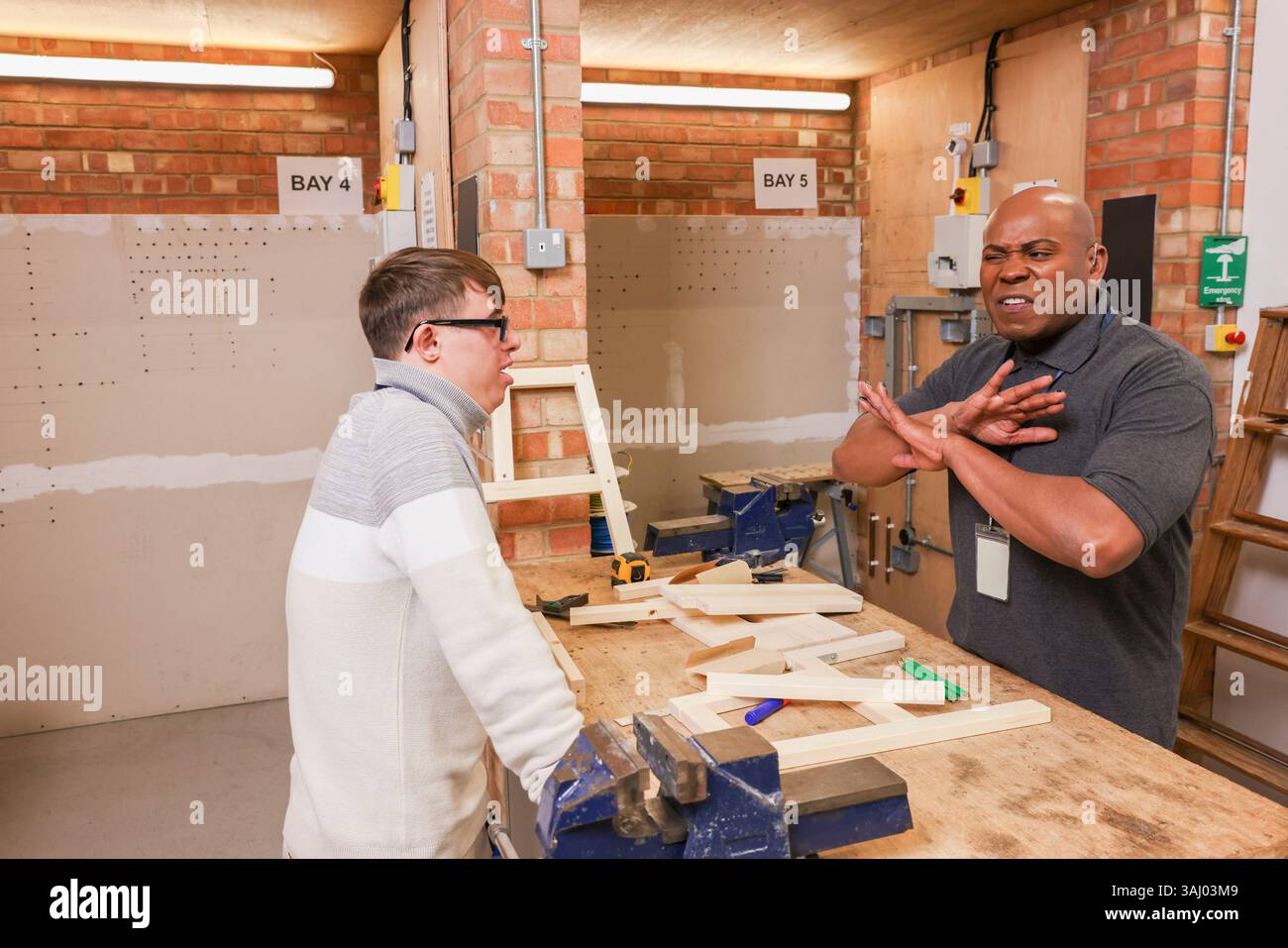 Disabled men working in workshop Stock Photo