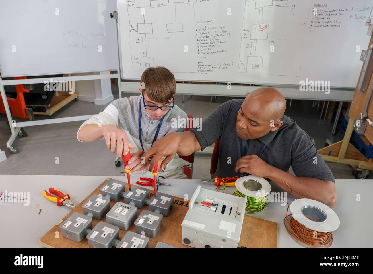 Disabled men working in workshop Stock Photo