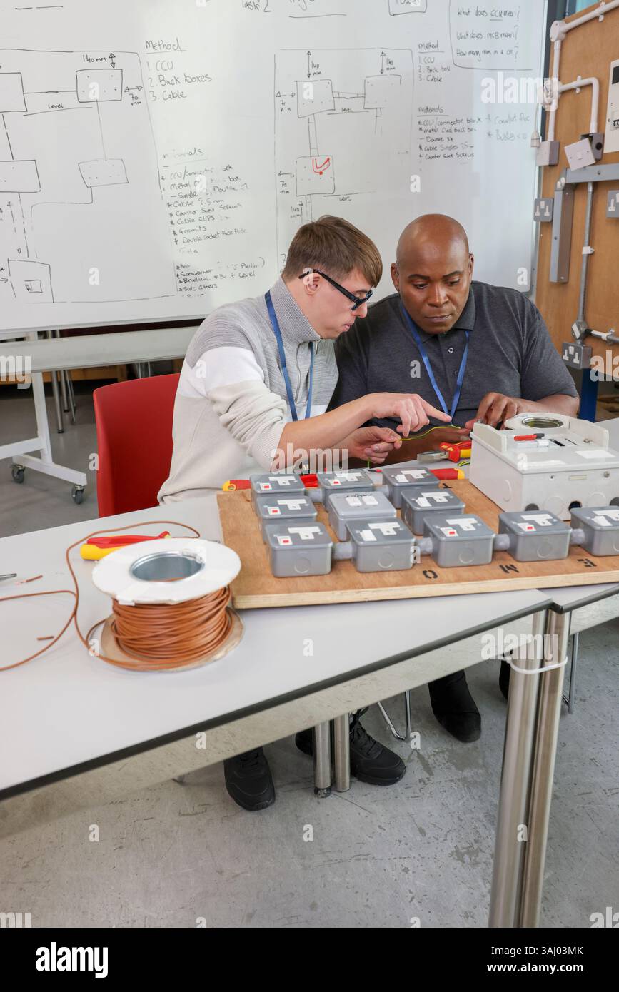 Disabled men working in workshop Stock Photo
