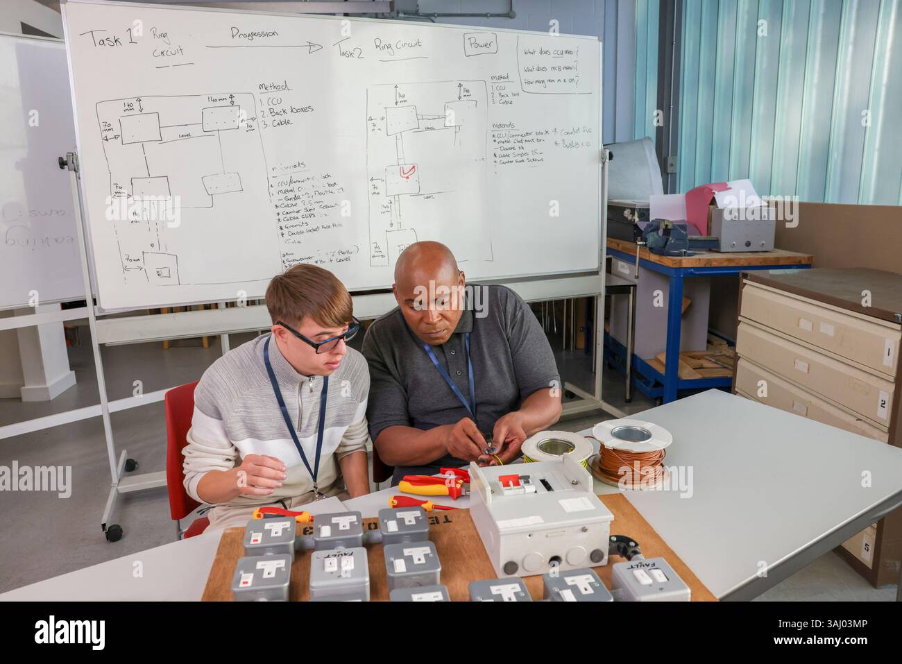 Disabled men working in workshop Stock Photo